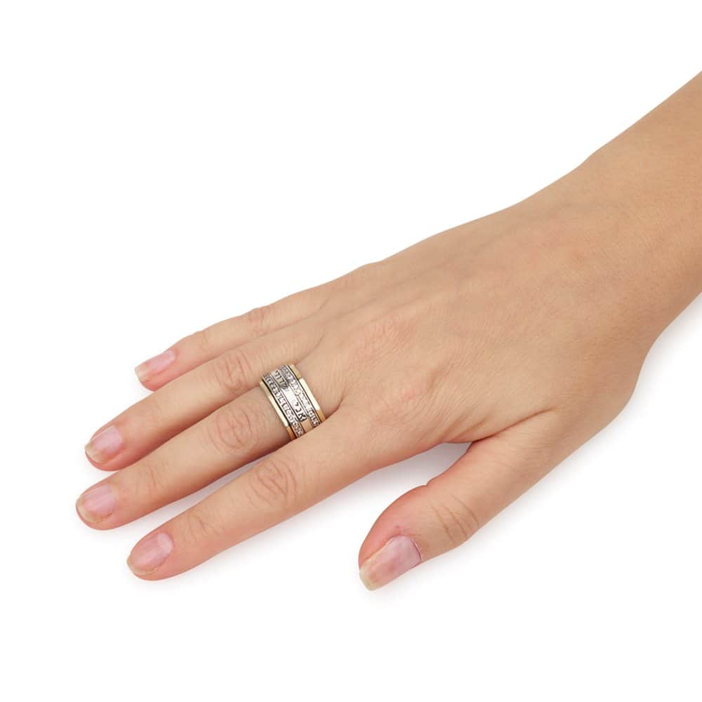 Woman wearing a wide Ani Ledodi Jewish love ring with sparkling CZ rows and genuine 9K gold accents