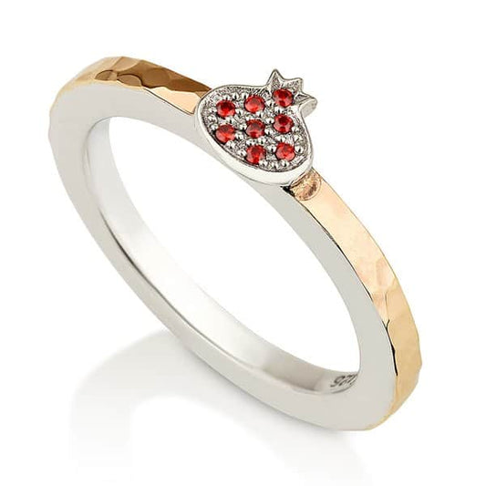 Pomegranate ring with red garnet stones, polished sterling silver and hammered 9K gold band on white background