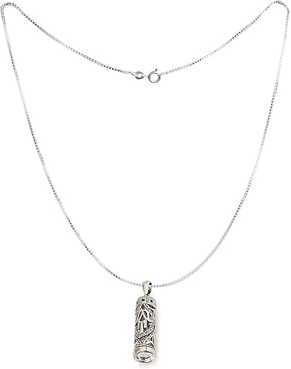 A silver chain necklace with a cylindrical pendant featuring an engraved figure, displayed against a solid white background.
